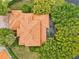 Bird's-eye view of a home with a terracotta tile roof and a pool at 10115 Day Lily Ct, Bradenton, FL 34212