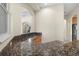 Custom wet bar with granite countertop and sink at 10115 Day Lily Ct, Bradenton, FL 34212