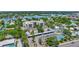 Aerial view of condo building, tennis court, and parking at 6157 Midnight Pass Rd # E24, Sarasota, FL 34242