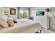 Main bedroom with king-size bed and ample closet space at 6157 Midnight Pass Rd # E24, Sarasota, FL 34242