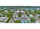 Aerial view of community, tennis court, and waterfront at 6157 Midnight Pass Rd # E24, Sarasota, FL 34242