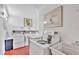 Well-lit laundry room with multiple washers and dryers at 6157 Midnight Pass Rd # E24, Sarasota, FL 34242