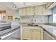 Updated kitchen with granite countertops and new appliances at 6157 Midnight Pass Rd # E24, Sarasota, FL 34242