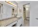 Bathroom features granite vanity and updated fixtures at 6157 Midnight Pass Rd # E24, Sarasota, FL 34242