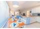 Bright kitchen with island and white cabinets at 2109 Avenue B, Bradenton Beach, FL 34217