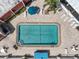 An aerial view reveals a sparkling pool surrounded by lounge chairs and a perfectly-manicured landscape at 220 Santa Maria St # 240, Venice, FL 34285