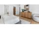 Bright bedroom with modern decor, stylish wooden cabinet, and a view to the closet at 2226 Grove St, Sarasota, FL 34239