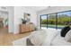 Inviting bedroom with modern furniture, opens to outdoor pool view with large sliding glass doors at 2226 Grove St, Sarasota, FL 34239