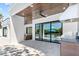 Covered patio with tile floor, ceiling fan, BBQ, and view of the pool and backyard at 2226 Grove St, Sarasota, FL 34239
