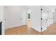 Bright hallway with hardwood flooring and white doors, offering a clean and modern aesthetic at 2226 Grove St, Sarasota, FL 34239