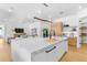 Open-concept kitchen with large island, hardwood floors, and modern design at 2226 Grove St, Sarasota, FL 34239