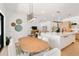 Open concept kitchen and living space featuring hardwood floors and modern lighting at 2226 Grove St, Sarasota, FL 34239