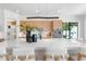 Open kitchen features a large island with seating, sleek appliances, and backyard views at 2226 Grove St, Sarasota, FL 34239