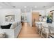 Spacious living room seamlessly connects to kitchen and features light hardwood floors at 2226 Grove St, Sarasota, FL 34239