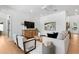 Inviting living room with stylish decor, light hardwood floors, and neutral color palette at 2226 Grove St, Sarasota, FL 34239
