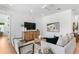 Inviting living room with stylish decor, light hardwood floors, and neutral color palette at 2226 Grove St, Sarasota, FL 34239