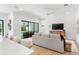 Bright living room with sliding doors to the pool and a modern entertainment center at 2226 Grove St, Sarasota, FL 34239