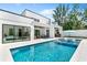 Stunning backyard pool with mosaic tile hot tub, outdoor kitchen, and covered patio offering a perfect relaxation space at 2226 Grove St, Sarasota, FL 34239