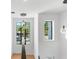 Contemporary staircase featuring stylish lighting, a modern aesthetic, and ample natural light at 2226 Grove St, Sarasota, FL 34239