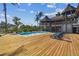 Large pool deck with lounge chairs, offering ample space for relaxation and entertainment at 7147 La Lenaire Dr, Longboat Key, FL 34228