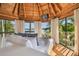 Waterfront bedroom with a cozy bed and large windows offering stunning views at 7147 La Lenaire Dr, Longboat Key, FL 34228