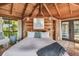 Main bedroom with king-size bed and access to private balcony and water views at 7147 La Lenaire Dr, Longboat Key, FL 34228