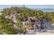 Beachfront home with tropical landscaping and private dock at 7147 La Lenaire Dr, Longboat Key, FL 34228