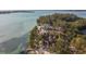 Aerial view showcasing the home's waterfront location and private beach access at 7147 La Lenaire Dr, Longboat Key, FL 34228