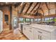 Island kitchen with white cabinets and quartz countertops, offering water views at 7147 La Lenaire Dr, Longboat Key, FL 34228