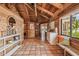 Open and inviting common area with wood-beamed ceiling and tile floors at 7147 La Lenaire Dr, Longboat Key, FL 34228
