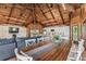Large dining table with seating for eight, located in open concept living space at 7147 La Lenaire Dr, Longboat Key, FL 34228