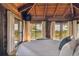 Bright bedroom with water views and high ceilings at 7147 La Lenaire Dr, Longboat Key, FL 34228