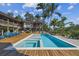 Inviting pool and spa with a large deck, offering waterfront views at 7147 La Lenaire Dr, Longboat Key, FL 34228