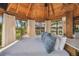 Bright bedroom with a king-size bed and serene water views at 7147 La Lenaire Dr, Longboat Key, FL 34228