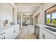 Open concept kitchen with island and stainless steel appliances, views to dining area at 7147 La Lenaire Dr, Longboat Key, FL 34228