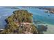 Island property with home, lush vegetation, and waterway views at 7147 La Lenaire Dr, Longboat Key, FL 34228