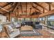 Open-concept living room with vaulted ceilings, comfortable seating, and water views at 7147 La Lenaire Dr, Longboat Key, FL 34228