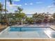 Inviting pool with spa and serene waterfront views at 7147 La Lenaire Dr, Longboat Key, FL 34228