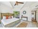 Main bedroom with king-size bed, and stunning nature views at 7147 La Lenaire Dr, Longboat Key, FL 34228