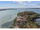 Aerial perspective highlighting the property's waterfront location and lush surroundings at 7147 La Lenaire Dr, Longboat Key, FL 34228