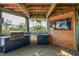 Outdoor kitchen with grill, sink, and refrigerator, perfect for entertaining at 7147 La Lenaire Dr, Longboat Key, FL 34228