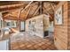 Open living area with wood-beamed ceiling and tiled floors at 7147 La Lenaire Dr, Longboat Key, FL 34228