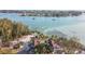 Wide aerial showcasing the home, beach, and surrounding landscape at 7147 La Lenaire Dr, Longboat Key, FL 34228