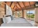 Main bedroom with king-size bed and stunning water views from private balcony at 7147 La Lenaire Dr, Longboat Key, FL 34228