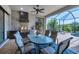 Covered patio with dining table and chairs, adjacent to pool at 4811 Cabreo Ct, Lakewood Ranch, FL 34211