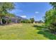 Landscaped backyard with view of neighboring homes at 4811 Cabreo Ct, Lakewood Ranch, FL 34211