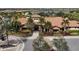 Clubhouse with Spanish-style architecture and lush landscaping at 4811 Cabreo Ct, Lakewood Ranch, FL 34211