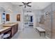 Elegant bathroom with double vanity, walk-in shower and view to bedroom at 4811 Cabreo Ct, Lakewood Ranch, FL 34211