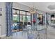Kitchen dining area with glass table and view of the pool at 4811 Cabreo Ct, Lakewood Ranch, FL 34211