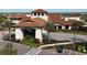 Luxury clubhouse with terracotta roof and landscaping at 4811 Cabreo Ct, Lakewood Ranch, FL 34211